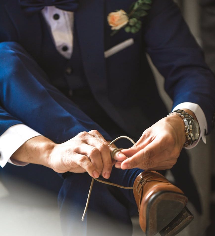 person tying shoelaces